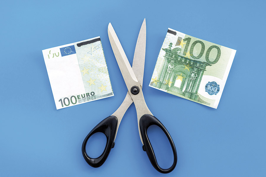 Scissors with a cut 100-euro note